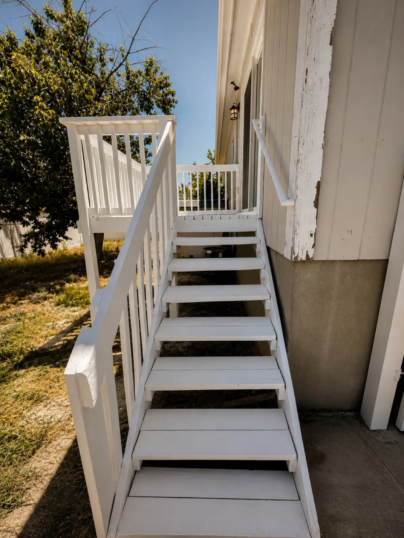 Restored and repainted exterior deck stairs
